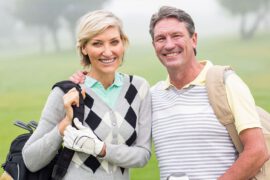 Middle age couple golfing