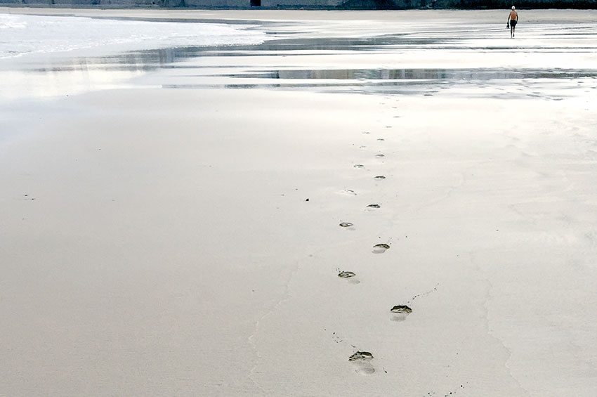 Foot prints on a sandy beach