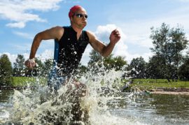 Triathlete running in water